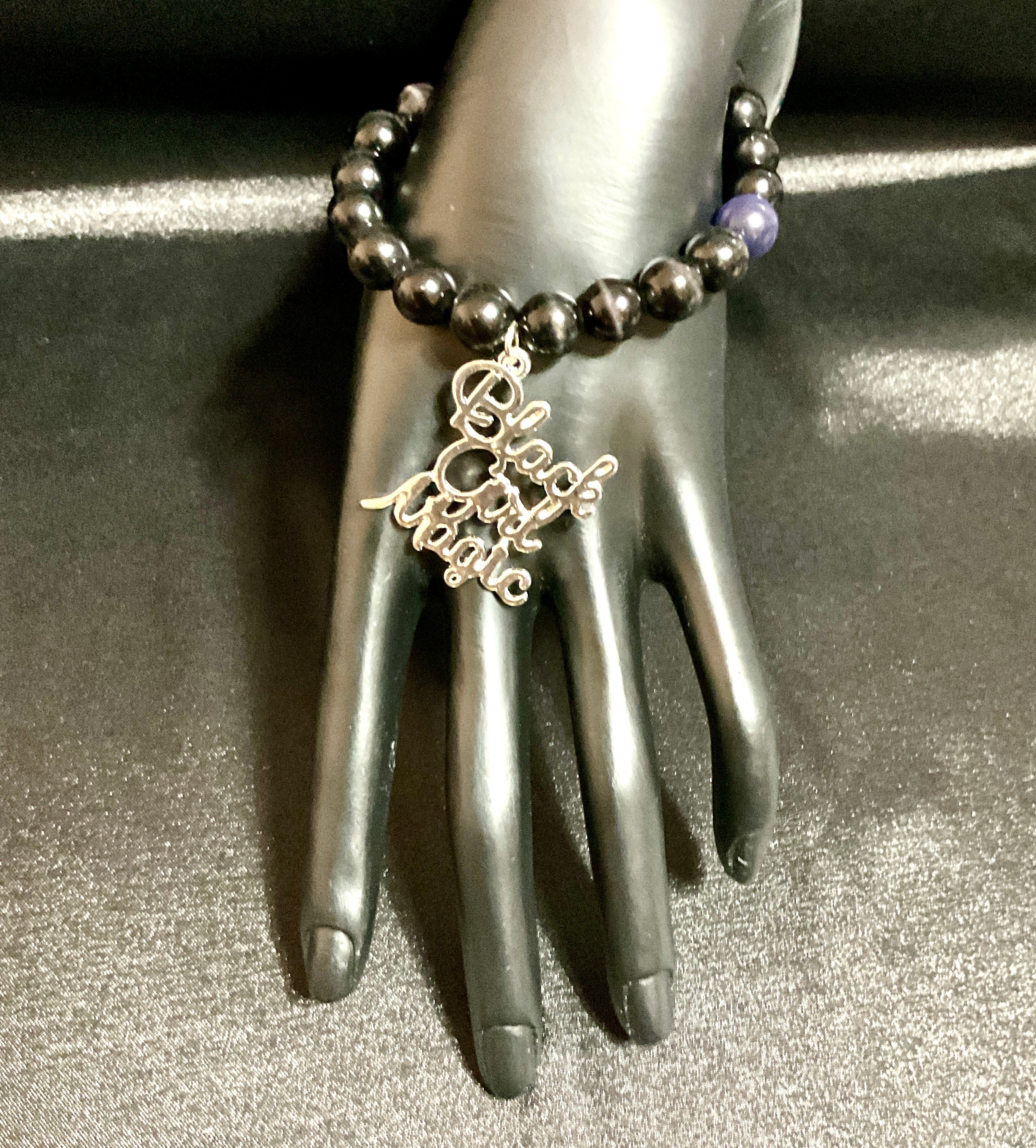 black cat eye bracelet with charm