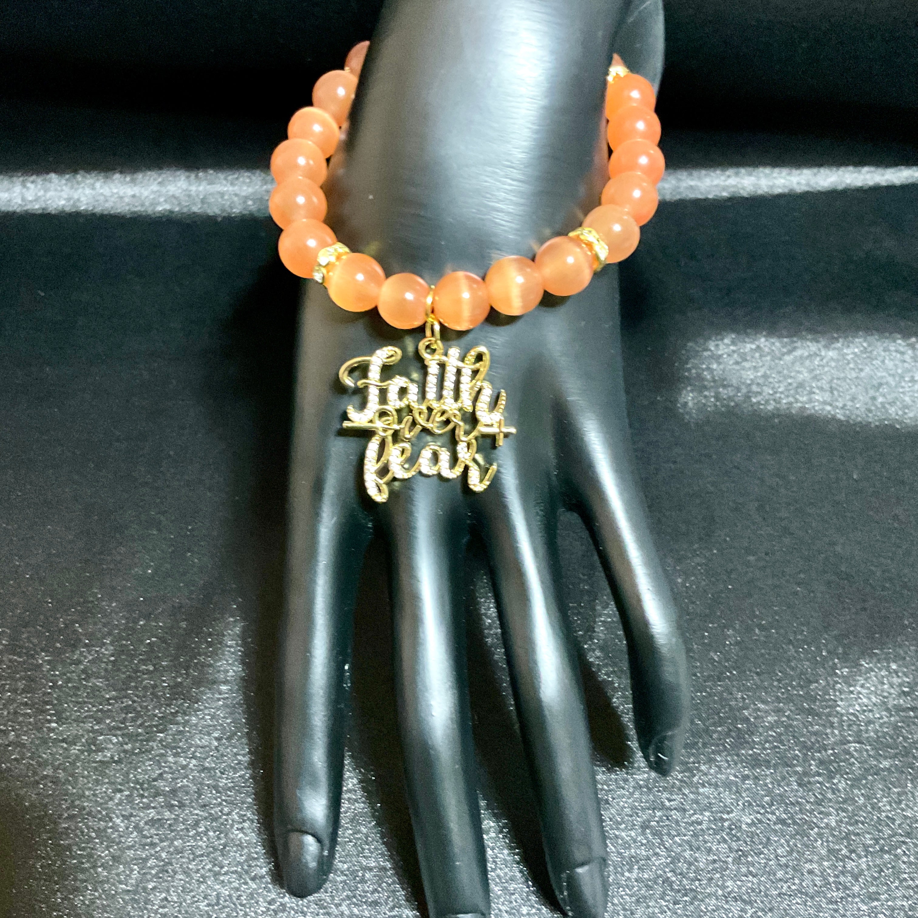 orange bracelet with charm
